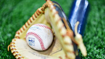 ST PETERSBURG, FLORIDA - MARCH 30: A ball, glove, and bat lay on the ground before a game between the Tampa Bay Rays and the Houst at Tropicana Field on March 30, 2019 in St Petersburg, Florida. (Photo by Julio Aguilar/Getty Images)