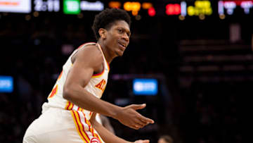 BOSTON, MASSACHUSETTS - FEBRUARY 13: De'Andre Hunter #12 of the Atlanta Hawks reacts during the second half of a game against the Boston Celtics at TD Garden on February 13, 2022 in Boston, Massachusetts. NOTE TO USER: User expressly acknowledges and agrees that, by downloading and or using this photograph, User is consenting to the terms and conditions of the Getty Images License Agreement. (Photo by Maddie Malhotra/Getty Images)
