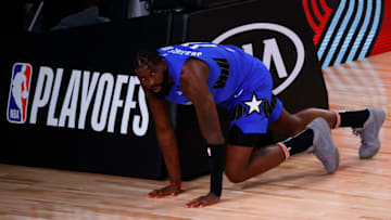 LAKE BUENA VISTA, FLORIDA - AUGUST 29: James Ennis III #11 of the Orlando Magic gets up off the court after throwing the ball away against the Milwaukee Bucks in Game Five of the Eastern Conference First Round during the 2020 NBA Playoffs at AdventHealth Arena at ESPN Wide World Of Sports Complex on August 29, 2020 in Lake Buena Vista, Florida. NOTE TO USER: User expressly acknowledges and agrees that, by downloading and or using this photograph, User is consenting to the terms and conditions of the Getty Images License Agreement. (Photo by Kevin C. Cox/Getty Images)