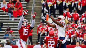 PISCATAWAY, NJ - OCTOBER 26: Malik Dixon #15 of the Rutgers Scarlet Knights breaks up a pass intended for Antonio Gandy-Golden #11 (R) of the Liberty Flames as Damon Hayes #22 looks on during the fourth quarter SHI Stadium on October 26, 2019 in Piscataway, New Jersey. Rutgers defeated Liberty 44-34. (Photo by Corey Perrine/Getty Images)