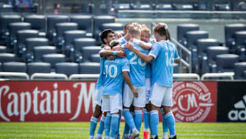 NEW YORK, NY - APRIL 24: Gudmundur Thorarinsson #20 of New York City and teammates celebrate the third goal of the match in the home opener match at Yankee Stadium on April 24, 2021 in New York City. (Photo by Ira L. Black - Corbis/Getty Images)