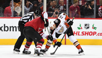 GLENDALE, ARIZONA - NOVEMBER 27: Ryan Getzlaf #15 of the Anaheim Ducks takes a face-off against the Arizona Coyotes at Gila River Arena on November 27, 2019 in Glendale, Arizona. (Photo by Norm Hall/NHLI via Getty Images)