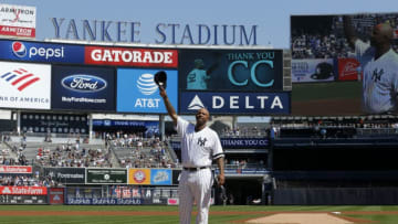 NEW YORK, NEW YORK - SEPTEMBER 22: CC Sabathia #52 of the New York Yankees salutes the crowd as he is honored prior to a game against the Toronto Blue Jays at Yankee Stadium on September 22, 2019 in the Bronx borough New York City. CC Sabathia is retiring at the end of the season. (Photo by Jim McIsaac/Getty Images)