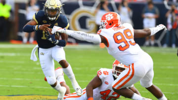 ATLANTA, GA - SEPTEMBER 22: TaQuon Marshall #16 of the Georgia Tech Yellow Jackets carries the ball against Clelin Ferrell #99 of the Clemson Tigers on September 22, 2018 in Atlanta, Georgia. (Photo by Scott Cunningham/Getty Images)