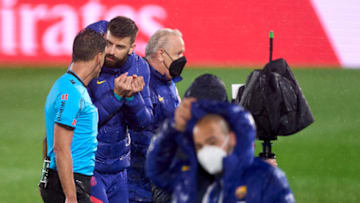 Gerard Pique of Barcelona protest to match referee Jesus Gil Manzano after the La Liga Santander match between Real Madrid and FC Barcelona. (Photo by Diego Souto/Quality Sport Images/Getty Images)