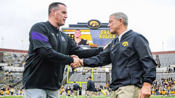 Oct 1, 2016; Iowa City, IA, USA; Iowa Hawkeyes head coach Kirk Ferentz and Northwestern Wildcats head coach Pat Fitzgerald shake hands before the game at Kinnick Stadium. Mandatory Credit: Jeffrey Becker-USA TODAY Sports