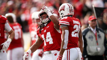 MADISON, WISCONSIN - NOVEMBER 03: D'Cota Dixon #14 and Eric Burrell #25 of the Wisconsin Badgers celebrate after Dixon returned a blocked field goal in the second quarter against the Rutgers Scarlet Knights at Camp Randall Stadium on November 03, 2018 in Madison, Wisconsin. (Photo by Dylan Buell/Getty Images)
