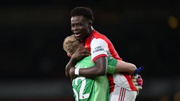 LONDON, ENGLAND - FEBRUARY 24: Aaron Ramsdale and Bukayo Saka of Arsenal celebrate following the Premier League match between Arsenal and Wolverhampton Wanderers at Emirates Stadium on February 24, 2022 in London, England. (Photo by Shaun Botterill/Getty Images)