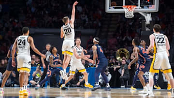 Auburn basketballIowa Hawkeyes guard Payton Sandfort (20) shoots a floater as Auburn Tigers take on Iowa Hawkeyes in the first round of NCAA Tournament at Legacy Arena in Birmingham, Ala., on Thursday, March 16, 2023. Auburn Tigers defeated Iowa Hawkeyes 83-75.