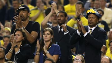 ATLANTA, GA - APRIL 08: (L-R) Former Michigan Wolverines players Juwan Howard, Jimmy King and Jalen Rose cheer for Michigan in the first half against the Louisville Cardinals during the 2013 NCAA Men's Final Four Championship at the Georgia Dome on April 8, 2013 in Atlanta, Georgia. (Photo by Andy Lyons/Getty Images)