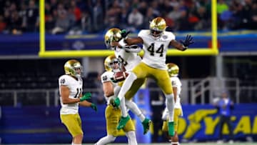 ARLINGTON, TEXAS - DECEMBER 29: DJ Brown #12 and Jamir Jones #44 of the Notre Dame Fighting Irish react after a play in the second half against the Clemson Tigers during the College Football Playoff Semifinal Goodyear Cotton Bowl Classic at AT&T Stadium on December 29, 2018 in Arlington, Texas. (Photo by Kevin C. Cox/Getty Images)