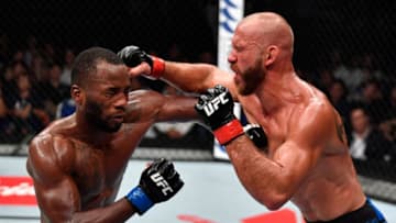 SINGAPORE - JUNE 23: (R-L) Donald Cerrone and Leon Edwards of Jamaica trade punches in their welterweight bout during the UFC Fight Night event at the Singapore Indoor Stadium on June 23, 2018 in Singapore. (Photo by Jeff Bottari/Zuffa LLC/Zuffa LLC via Getty Images)