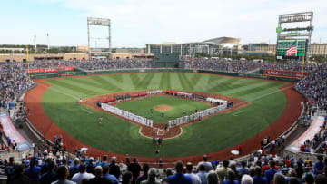 OMAHA, NEBRASKA - JUNE 13: A general view as the players from each of the 8 College World Series teams line up with the Detroit Tigers and the Kansas City Royals during the National Anthem ahead of the game at TD America Park on June 13, 2019 in Omaha, Nebraska. (Photo by Jamie Squire/Getty Images)