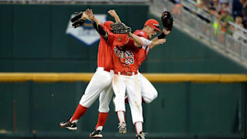 Jun 22, 2016; Omaha, NE, USA; Arizona Wildcats outfielder Jared Oliva (42) and outfielder Justin Behnke (4) and outfielder Zach Gibbons (23) celebrate the win against the UC Santa Barbara Gauchos in the 2016 College World Series at TD Ameritrade Park. Arizona defeated UC Santa Barbara 3-0. Mandatory Credit: Steven Branscombe-USA TODAY Sports