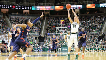 EAST LANSING, MI - JANUARY 7: Matt McQuaid #20 of the Michigan State Spartans shoots a three pointer in the second half against the Illinois Fighting Illini on January 7, 2016 in East Lansing, Michigan. (Photo by Rey Del Rio/Getty Images)