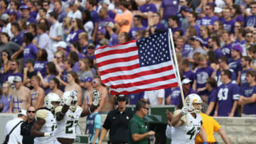 MANHATTAN, KS - SEPTEMBER 30: Baylor Bears fullback Kyle Boyd (47) carries the US Flag onto the field before a Big 12 game between the Baylor Bears and Kansas State Wildcats on September 30, 2017 at Bill Snyder Family Football Stadium in Manhattan, KS. Kansas State won 33-20. (Photo by Scott Winters/Icon Sportswire via Getty Images)