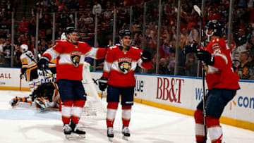 SUNRISE, FL - OCT. 22: Denis Malgin #62 of the Florida Panthers celebrates his goal with teammates Jonathan Huberdeau #11 and Evgeni Dadonov #63 during the second period against the Pittsburgh Penguins at the BB&T Center on October 22, 2019 in Sunrise, Florida. (Photo by Eliot J. Schechter/NHLI via Getty Images)