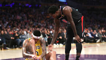 LOS ANGELES, CALIFORNIA - MARCH 04: Kyle Kuzma #0 of the Los Angeles Lakers grabs his ankle after landing awkwardly as Patrick Beverley #21 of the Los Angeles Clippers offers support during the second half of a gameat Staples Center on March 04, 2019 in Los Angeles, California. (Photo by Sean M. Haffey/Getty Images)