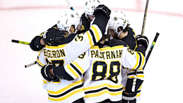 TORONTO, ONTARIO - AUGUST 31: David Pastrnak #88 of the Boston Bruins is congratulated by his teammates after scoring a goal against the Tampa Bay Lightning during the second period in Game Five of the Eastern Conference Second Round during the 2020 NHL Stanley Cup Playoffs at Scotiabank Arena on August 31, 2020 in Toronto, Ontario. (Photo by Elsa/Getty Images)