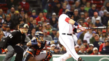 BOSTON, MA - September 9: Mitch Moreland #18 of the Boston Red Sox hits the game-winning walk off in the ninth inning to defeat the Houston Astros at Fenway Park on September 9, 2018 in Boston, Massachusetts. (Photo by Adam Glanzman/Getty Images)