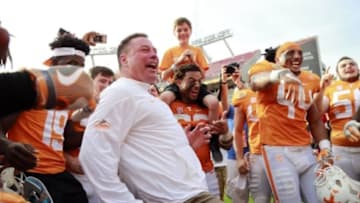 Jan 1, 2016; Tampa, FL, USA; Tennessee Volunteers head coach Butch Jones and his team celebrate as they beat the Northwestern Wildcats in the 2016 Outback Bowl at Raymond James Stadium. Tennessee Volunteers defeated the Northwestern Wildcats 45-6. Tennessee Volunteers Mandatory Credit: Kim Klement-USA TODAY Sports