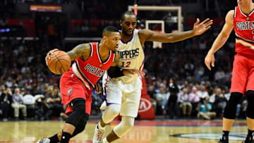 Nov 9, 2016; Los Angeles, CA, USA; Portland Trail Blazers guard Damian Lillard (0) drives against Los Angeles Clippers forward Luc Mbah a Moute (12) during the first half of a NBA basketball game at Staples Center. Mandatory Credit: Kirby Lee-USA TODAY Sports