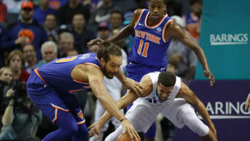CHARLOTTE, NC - DECEMBER 18: Michael Carter-Williams #10 of the Charlotte Hornets goes after a loose ball against Joakim Noah #13 of the New York Knicks during their game at Spectrum Center on December 18, 2017 in Charlotte, North Carolina. NOTE TO USER: User expressly acknowledges and agrees that, by downloading and or using this photograph, User is consenting to the terms and conditions of the Getty Images License Agreement. (Photo by Streeter Lecka/Getty Images)
