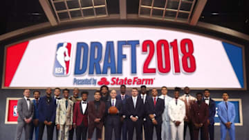 NEW YORK, NY - JUNE 21: NBA Commissioner Adam Silver poses with (L-R) Donte DiVincenzo, Jerome Robinson, Mikal Bridges, Kevin Knox, Shai Gilgeous-Alexander, Wendell Carter Jr., Collin Sexton, Marvin Bagley III, Trae Young, Deandre Ayton, Luka Doncic, Miles Bridges, Michael Porter Jr., Lonnie Walker IV, Jaren Jackson, Aaron Holiday, Chandler Hutchison and Zhaire Smith pose for a photo before the 2018 NBA Draft at the Barclays Center on June 21, 2018 in the Brooklyn borough of New York City. NOTE TO USER: User expressly acknowledges and agrees that, by downloading and or using this photograph, User is consenting to the terms and conditions of the Getty Images License Agreement. (Photo by Mike Stobe/Getty Images)