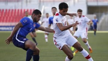 Oct 13, 2015; Sandy, UT, USA; United States defender Cameron Carter-Vickers (4) battles for the ball with Canada forward Caleb Clarke (10) in the first half at Rio Tinto Stadium. Mandatory Credit: Jeff Swinger-USA TODAY Sports