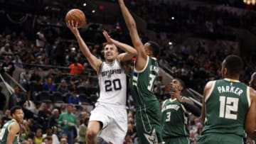 Dec 2, 2015; San Antonio, TX, USA; San Antonio Spurs shooting guard Manu Ginobili (20) shoots the ball as Milwaukee Bucks power forward John Henson (R) defends during the first half at AT&T Center. Mandatory Credit: Soobum Im-USA TODAY Sports
