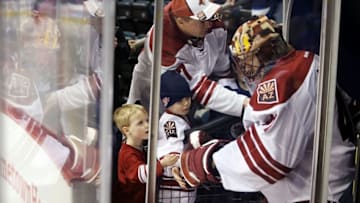 Jan 18, 2015; Winnipeg, Manitoba, CAN; Arizona Coyotes goalie Mike Smith (41) is greeted by young fans prior to the game against the Winnipeg Jets at MTS Centre. Mandatory Credit: Bruce Fedyck-USA TODAY Sports