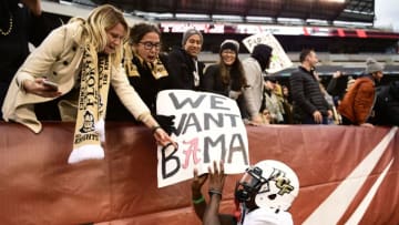 PHILADELPHIA, PA - NOVEMBER 18: Emmanuel Logan-Greene #7 of the UCF Knights touches a fan's sign after the win at Lincoln Financial Field on November 18, 2017 in Philadelphia, Pennsylvania. UCF defeated Temple 45-19. (Photo by Corey Perrine/Getty Images)