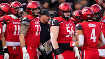 Cincinnati Bearcats take the field during the American Athletic Conference championship against the Houston Cougars at Nippert Stadium. The Enquirer.