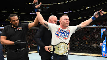 CHICAGO, ILLINOIS - JUNE 09: UFC President Dana White places the interim welterweight championship belt on Colby Covington after defeating Rafael Dos Anjos of Brazil in their interim welterweight title fight during the UFC 225 event at the United Center on June 9, 2018 in Chicago, Illinois. (Photo by Josh Hedges/Zuffa LLC/Zuffa LLC via Getty Images)
