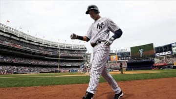July 11, 2013; New York, NY, USA; New York Yankees designated hitter Derek Jeter walks back to the dugout after driving in a run with a ground out against the Kansas City Royals in the 6th inning during the game at Yankee Stadium. Mandatory Credit: John Munson/THE STAR-LEDGER via USA TODAY Sports