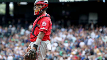 SEATTLE, WA - JUNE 13: Martin Maldonado #12 of the Los Angeles Angels of Anaheim reacts after giving up a two run home run to Nelson Cruz #23 of the Seattle Mariners in the third inning during their game at Safeco Field on June 13, 2018 in Seattle, Washington. (Photo by Abbie Parr/Getty Images)