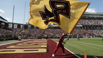 Sep 4, 2021; Chestnut Hill, Massachusetts, USA; A Boston College Eagles cheerleader waves a BC flag after a touchdown against the Colgate Raiders during the first half at Alumni Stadium. Mandatory Credit: Winslow Townson-USA TODAY Sports
