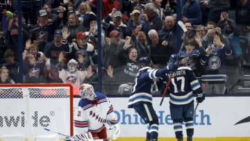 COLUMBUS, OHIO - OCTOBER 14: Justin Danforth #17 of the Columbus Blue Jackets is congratulated by Kent Johnson #91 after beating Igor Shesterkin #31 of the New York Rangers for a goal during the third period of the game at Nationwide Arena on October 14, 2023 in Columbus, Ohio. Columbus defeated New York 5-3. (Photo by Kirk Irwin/Getty Images)