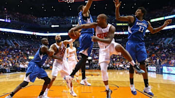 Mar 14, 2016; Phoenix, AZ, USA; Phoenix Suns forward P.J. Tucker (17) passes the ball against Minnesota Timberwolves center Karl-Anthony Towns (32) and guard Andrew Wiggins (22) at Talking Stick Resort Arena. The Suns defeated the Timberwolves 107-104. Mandatory Credit: Mark J. Rebilas-USA TODAY Sports
