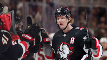BUFFALO, NEW YORK - JANUARY 07: Rasmus Dahlin #26 of the Buffalo Sabres celebrates with teammates after scoring a goal during the third period of an NHL hockey game against the Minnesota Wild at KeyBank Center on January 07, 2023 in Buffalo, New York. (Photo by Joshua Bessex/Getty Images)