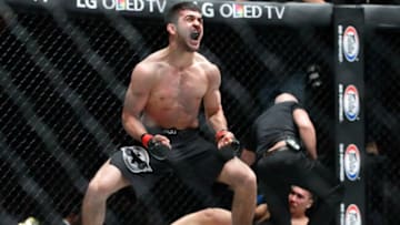 SINGAPORE - MAY 06: Saygid Guseyn Arslanaliev (front) of Russia reacts after defeating Ma Jia Wen of China in the lightweight bout during One Championship: Ascent to Power at Singapore Indoor Stadium on May 6, 2016 in Singapore. (Photo by Suhaimi Abdullah/Getty Images)