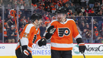PHILADELPHIA, PA - MARCH 25: Scott Laughton #21 of the Philadelphia Flyers celebrates with Rasmus Ristolainen #55 after scoring a goal against the Detroit Red Wings in the second period at the Wells Fargo Center on March 25, 2023 in Philadelphia, Pennsylvania. (Photo by Mitchell Leff/Getty Images)