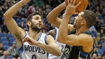 Jan 2, 2016; Minneapolis, MN, USA; Milwaukee Bucks guard Michael Carter-Williams (5) shoots in front of Minnesota Timberwolves guard Ricky Rubio (9) in the first quarter at Target Center. Mandatory Credit: Bruce Kluckhohn-USA TODAY Sports