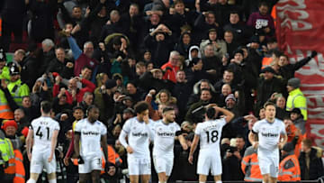 West Ham United's Spanish midfielder Pablo Fornals (2R) celebrates scoring his team's second goal during the English Premier League football match between Liverpool and West Ham United at Anfield in Liverpool, north west England on February 24, 2020. (Photo by Paul ELLIS / AFP) / RESTRICTED TO EDITORIAL USE. No use with unauthorized audio, video, data, fixture lists, club/league logos or 'live' services. Online in-match use limited to 120 images. An additional 40 images may be used in extra time. No video emulation. Social media in-match use limited to 120 images. An additional 40 images may be used in extra time. No use in betting publications, games or single club/league/player publications. / (Photo by PAUL ELLIS/AFP via Getty Images)
