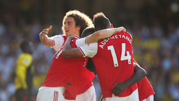WATFORD, ENGLAND - SEPTEMBER 15: Pierre-Emerick Aubameyang of Arsenal (14) celebrates as he scores his team's first goal with Matteo Guendouzi and team mates during the Premier League match between Watford FC and Arsenal FC at Vicarage Road on September 15, 2019 in Watford, United Kingdom. (Photo by Marc Atkins/Getty Images)
