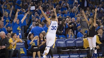 April 13, 2016; Oakland, CA, USA; Golden State Warriors guard Stephen Curry (30) celebrates after making his 400th three-point basket during the third quarter against the Memphis Grizzlies at Oracle Arena. The Warriors defeated the Grizzlies 125-104. Mandatory Credit: Kyle Terada-USA TODAY Sports