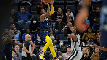 Feb 28, 2022; Memphis, Tennessee, USA; Memphis Grizzles guard Ja Morant (12) shoots with 0.4 seconds left in the first half against the San Antonio Spurs at FedExForum. (Petre Thomas-USA TODAY Sports)