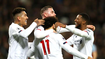 LONDON, ENGLAND - JANUARY 29: Mohamed Salah of Liverpool celebrates with teammates after scoring his team's first goal during the Premier League match between West Ham United and Liverpool FC at London Stadium on January 29, 2020 in London, United Kingdom. (Photo by Julian Finney/Getty Images)
