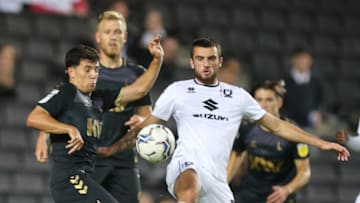 MILTON KEYNES, ENGLAND - AUGUST 17: Troy Parrott of Milton Keynes Dons attempts to control the ball watched by Albie Morgan of Charlton Athletic during the Sky Bet League One match between Milton Keynes Dons and Charlton Athletic at Stadium mk on August 17, 2021 in Milton Keynes, England. (Photo by Pete Norton/Getty Images)