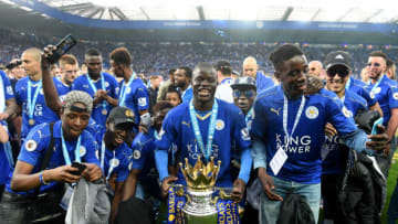 LEICESTER, ENGLAND - MAY 07: Ngolo Kante of Leicester City poses with the Premier League Trophy with his family as players and staffs celebrate the season champion after the Barclays Premier League match between Leicester City and Everton at The King Power Stadium on May 7, 2016 in Leicester, United Kingdom. (Photo by Michael Regan/Getty Images)